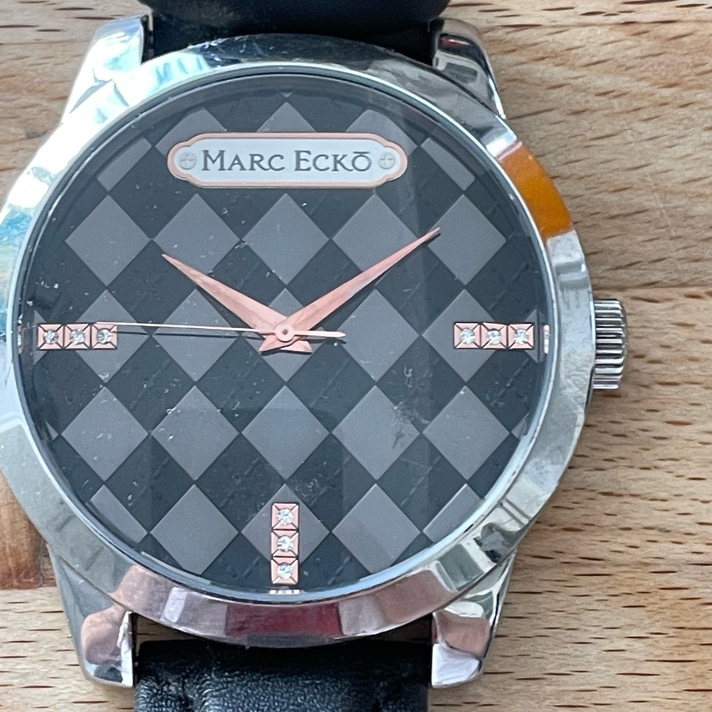 Marc Ecko steel and leather watch. Very good condition. Needs new battery.